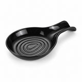 One black plastic kitchen spoon rest sits alone on a pure white studio background.