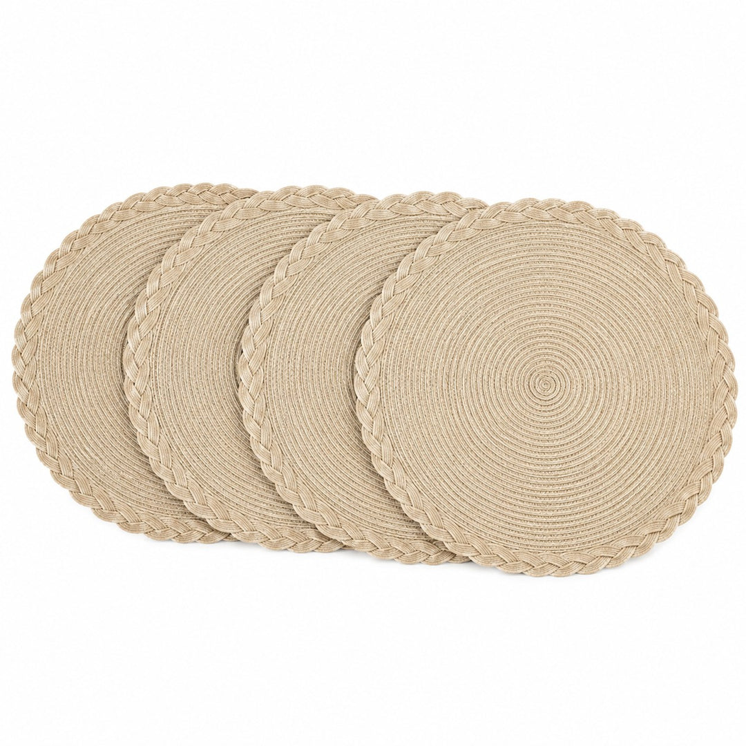 Four beige round woven placemats with braided edges arranged on a white background.