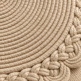 Close view of beige woven placemat cords and the braided scalloped border.