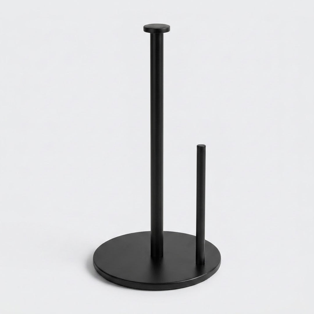 A matte black paper towel holder with two vertical stand arms and a round base, shown on a clean light gray background.