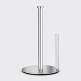 A modern stainless steel paper towel holder with a circular base, featuring one tall pole and one short side pole, shown on a light gray background.