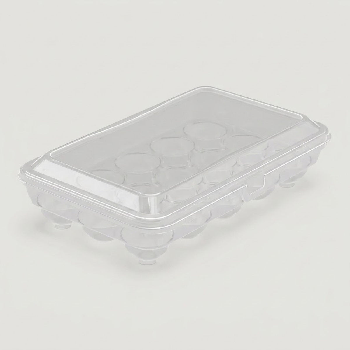 A clear plastic egg carton with a matching transparent lid, photographed on a plain light gray background.