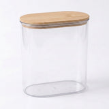 A clear plastic storage jar with an oval-shaped light brown bamboo lid, shown on a clean white background.