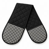 One black quilted houndstooth double oven mitt lies alone on a white background.