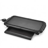 Black electric flat-top grill with a sliding plate and power cord, shown on a white background.