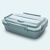 A rectangular plastic lunch box with a matching lid, shown on a clean light gray background. The container has a muted blue-gray color with a translucent lid and molded handle details.