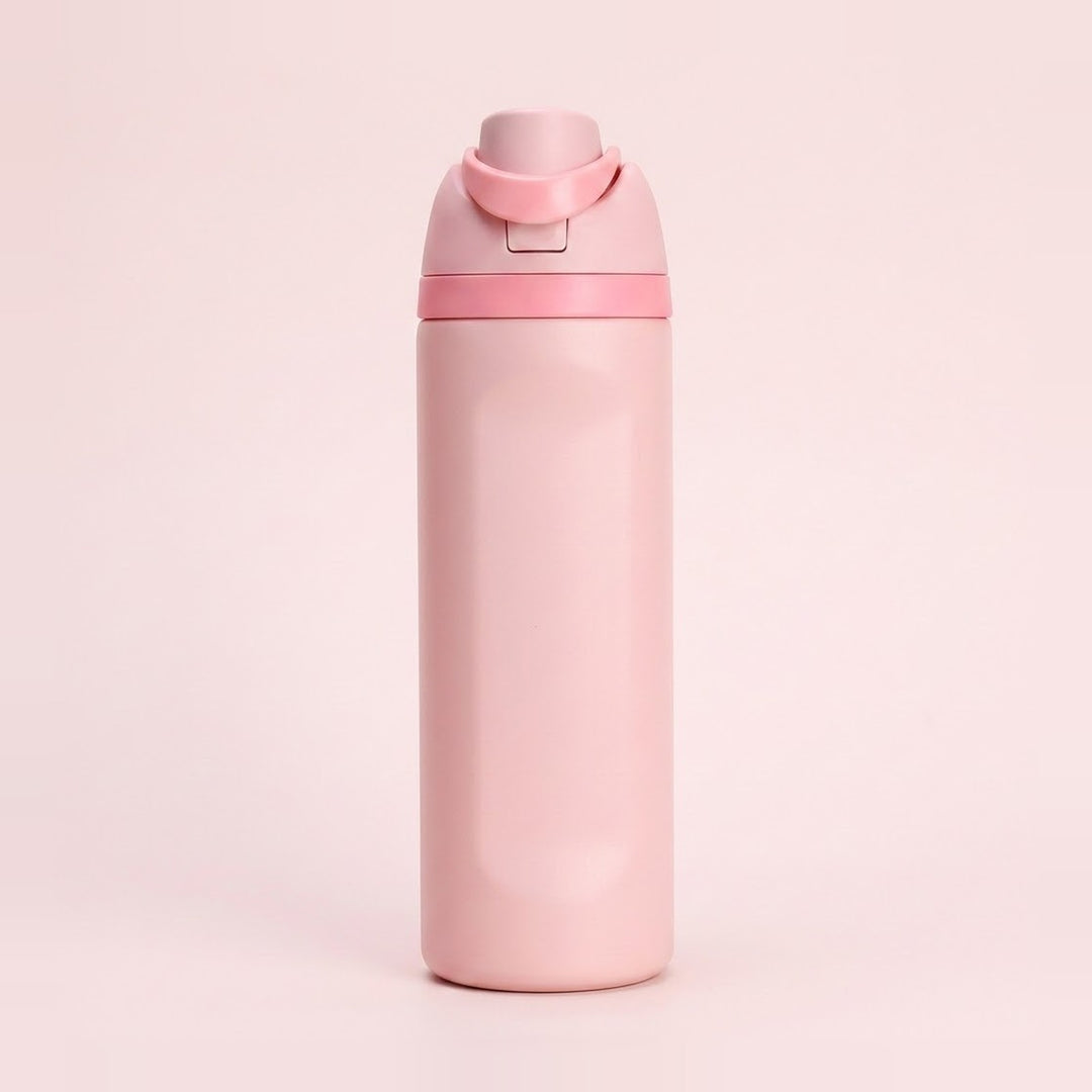 A matte light pink water bottle with a matching pink flip-top lid and carrying loop, centered on a solid pale pink background.