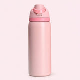 A matte light pink water bottle with a matching pink flip-top lid, centered against a solid pale pink background.