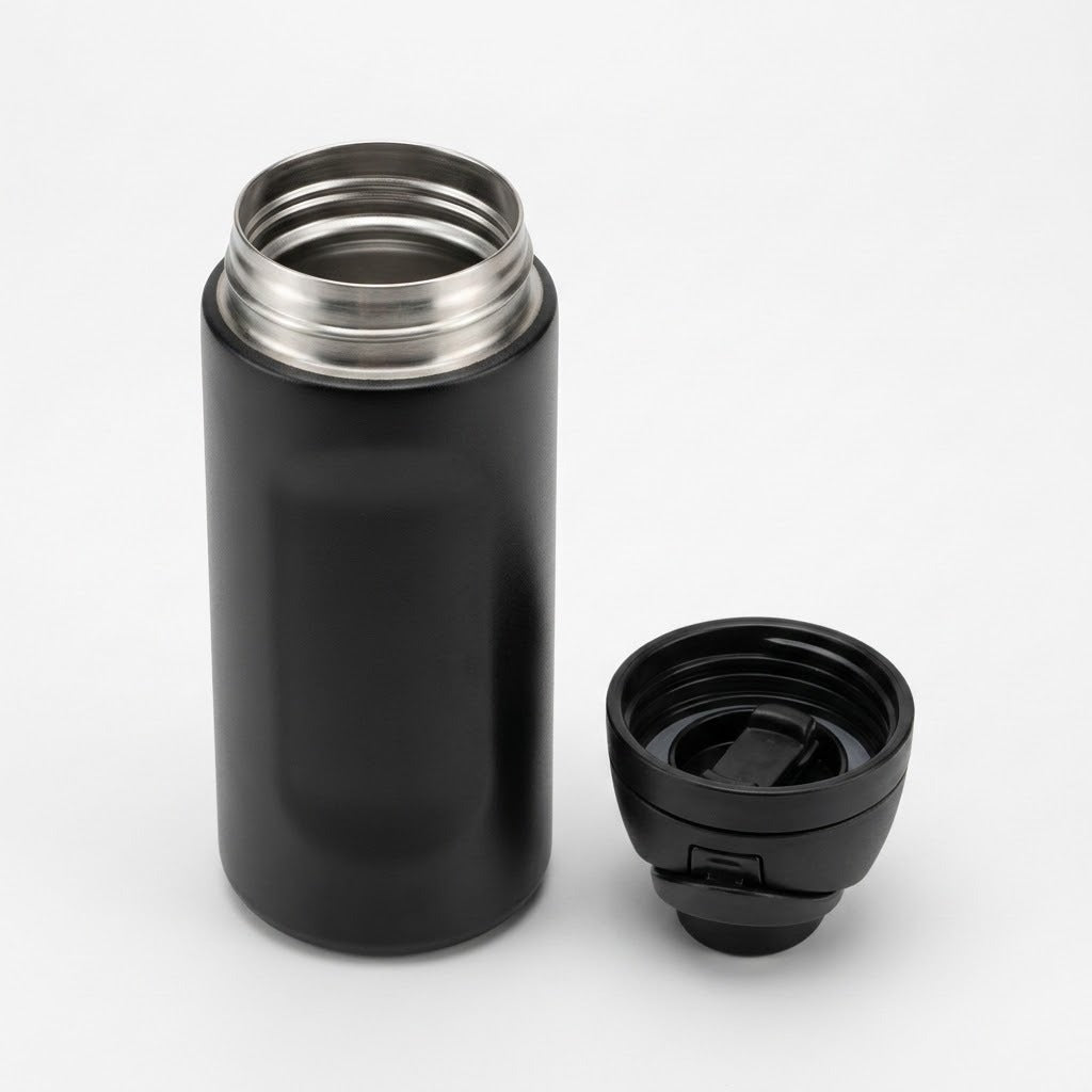 A black insulated bottle with its stainless steel opening exposed, shown next to its black lid on a light gray background.