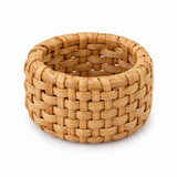 One natural basket weave rattan napkin ring shown alone against a white background.