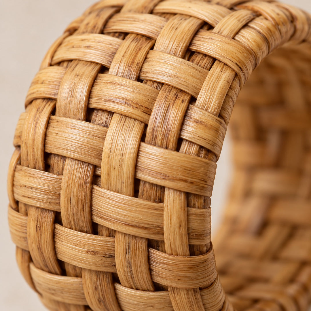 Macro view reveals the fine natural fibers and smooth woven finish of the rattan ring.