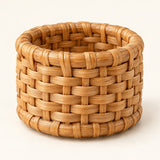 Close hero view shows the napkin ring’s sturdy, tightly woven rattan basket weave.