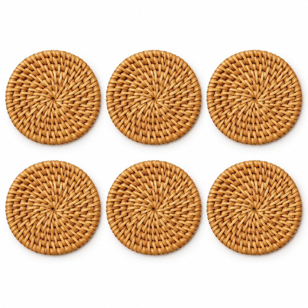 Six round rattan coasters arranged on white show the pieces included in the set.