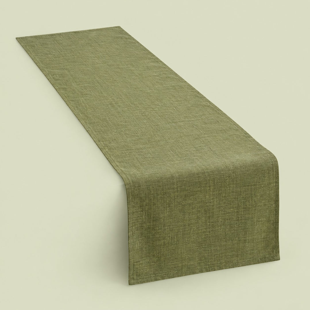 Olive green rectangular cotton linen table runner centered on a soft green studio background.