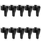 Ten black plastic clip-on bottle stoppers arranged in two rows of five on a plain white background.