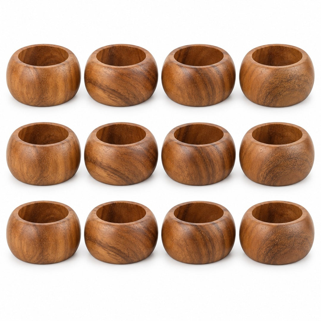 Twelve matching acacia wood napkin rings are arranged together on a clean white background.