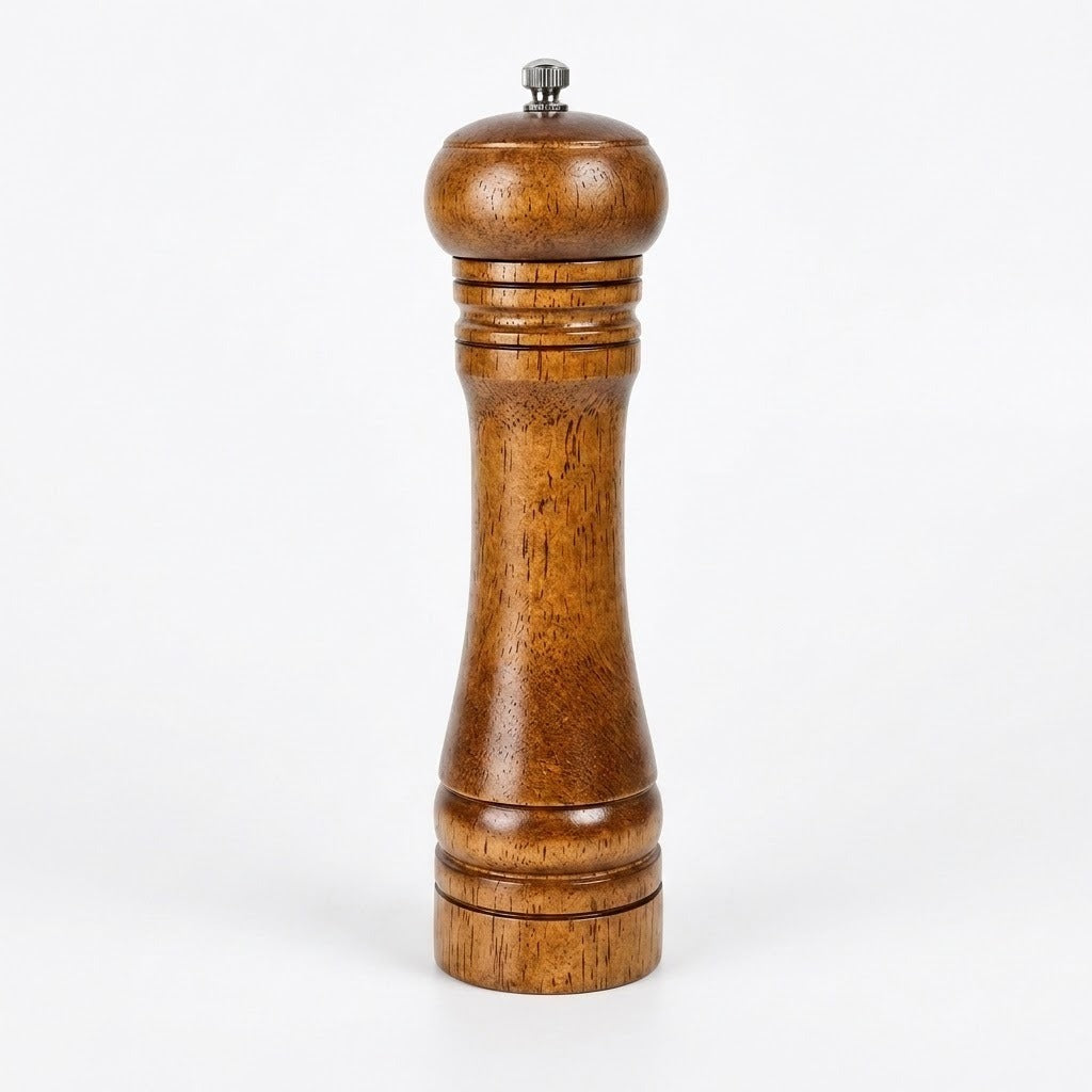 A classic wooden pepper mill with a warm brown wood grain finish and a small silver metal top knob, set against a plain white background.