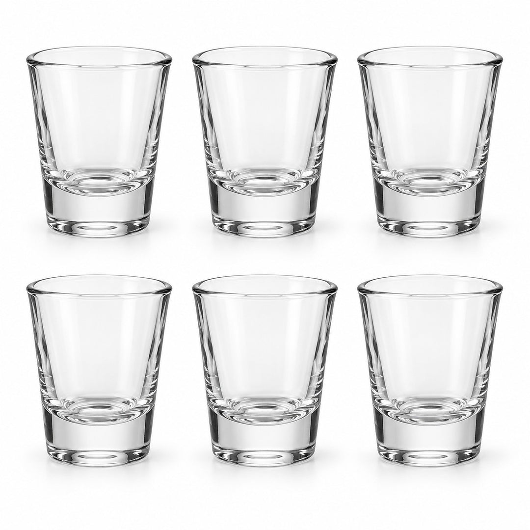 Six matching clear glass shot glasses are arranged together on a white background.