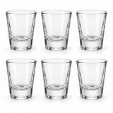 Six matching clear glass shot glasses are arranged together on a white background.
