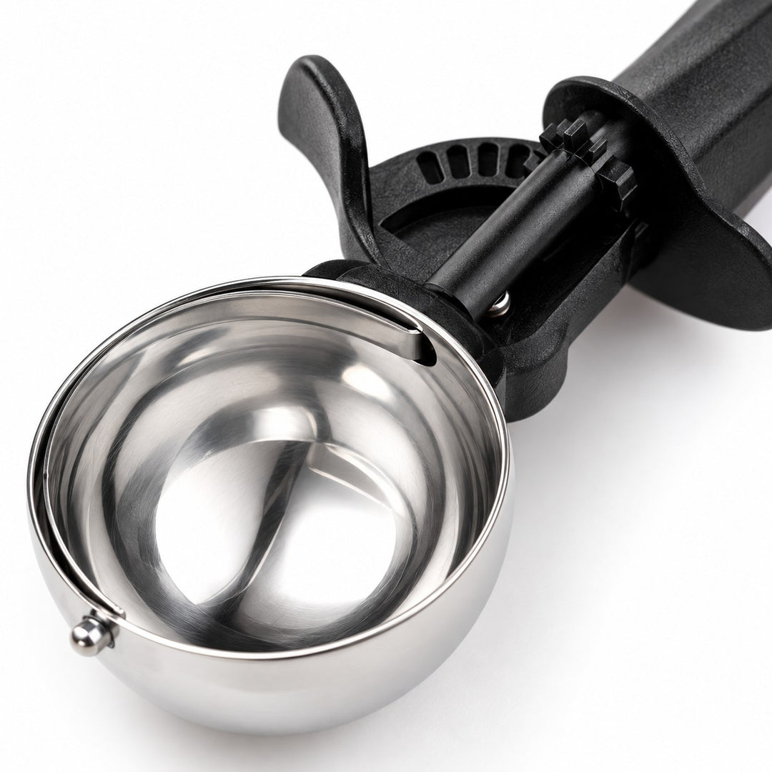 Close-up of the scoop’s reflective stainless steel bowl and textured black ABS handle.