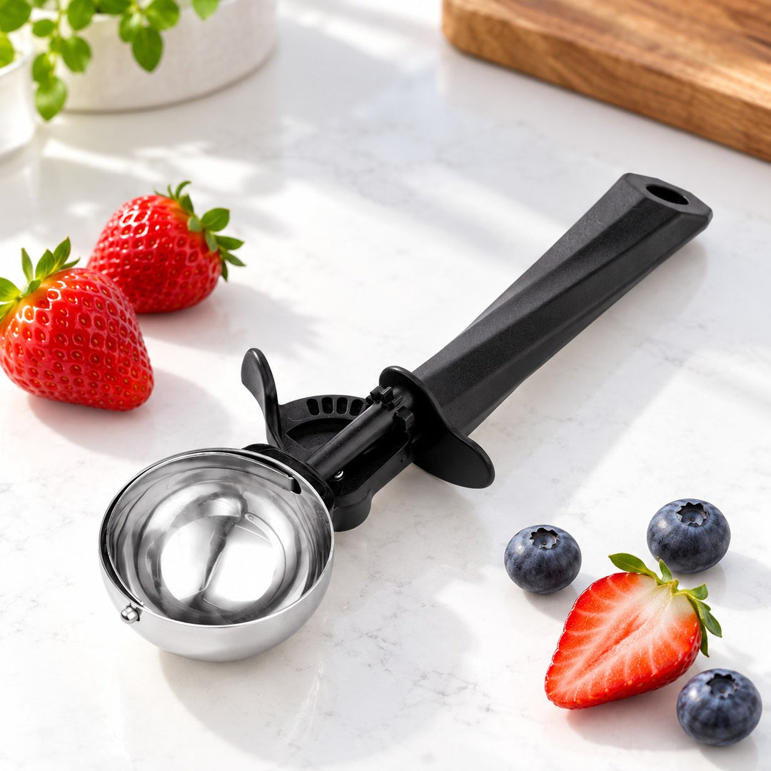 Ice Cream and Cookie Scoop shown beside berries to suggest its everyday serving scale.