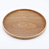 A round wooden serving tray with a natural wood grain pattern and a smooth, light-colored rim, shown on a plain white background.