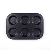 Black six-cup muffin tray on a white background