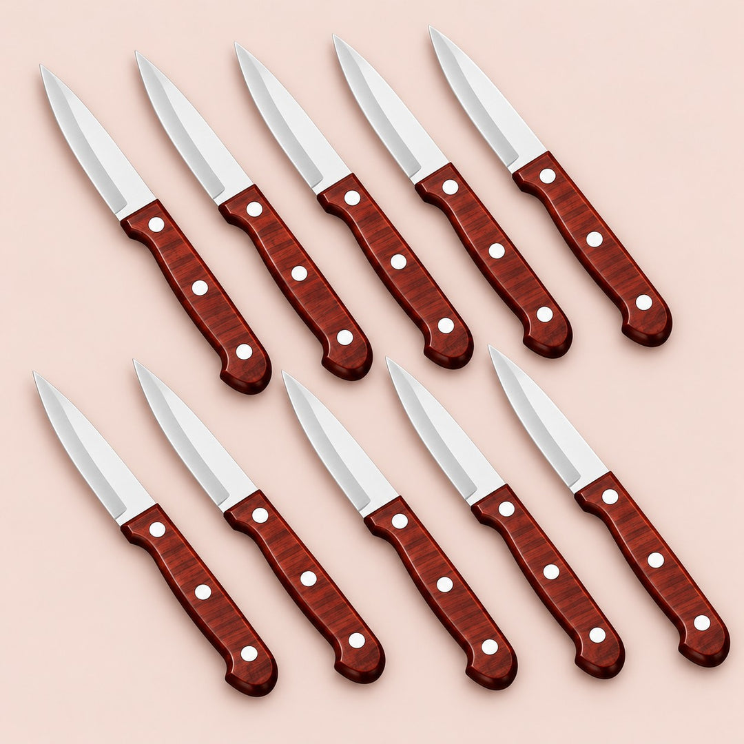 Ten stainless steel paring knives with reddish three-rivet handles arranged on a soft rose backdrop.