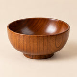 Japanese-style wooden soup bowl displayed close-up to show its warm natural grain and smooth finish.