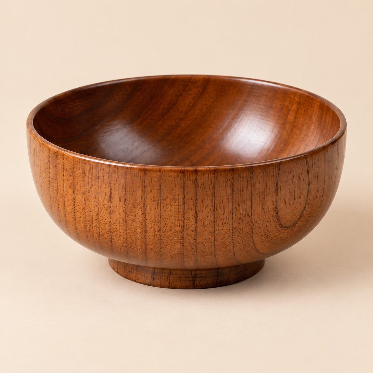 18 cm Japanese-style wooden soup bowl centered on a warm tan studio background.