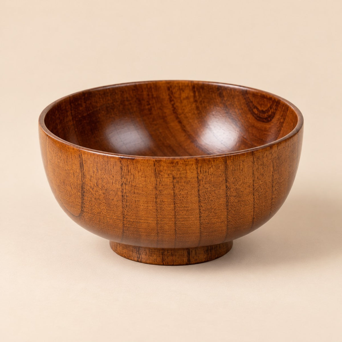 15 cm Japanese-style wooden soup bowl centered on a warm tan studio background.