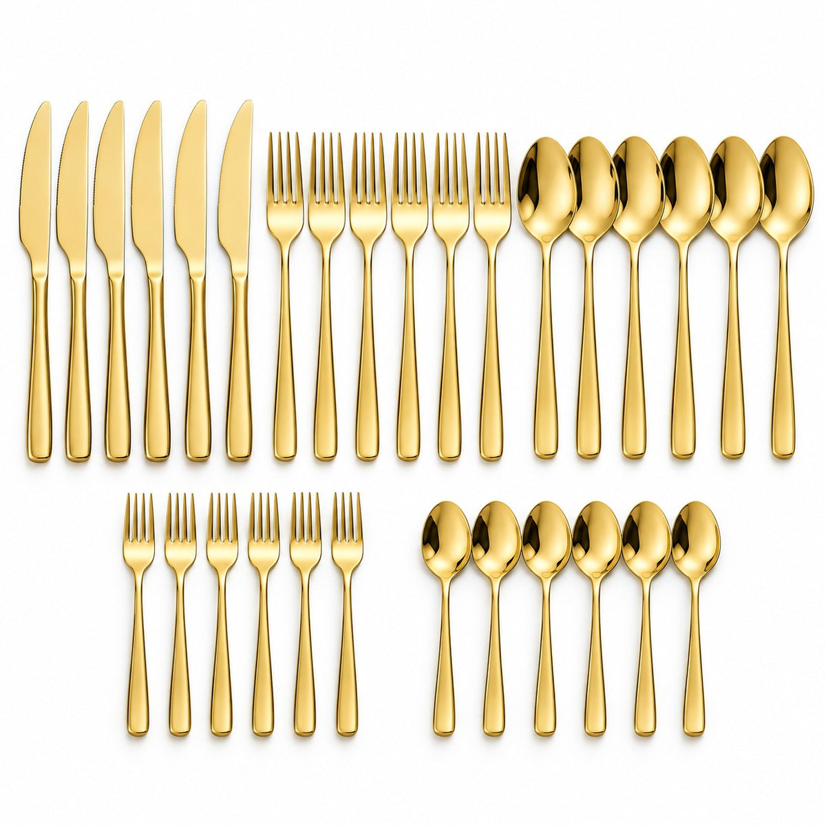The 30-piece gold stainless steel cutlery set is arranged in groups of knives, forks, spoons and tea utensils.