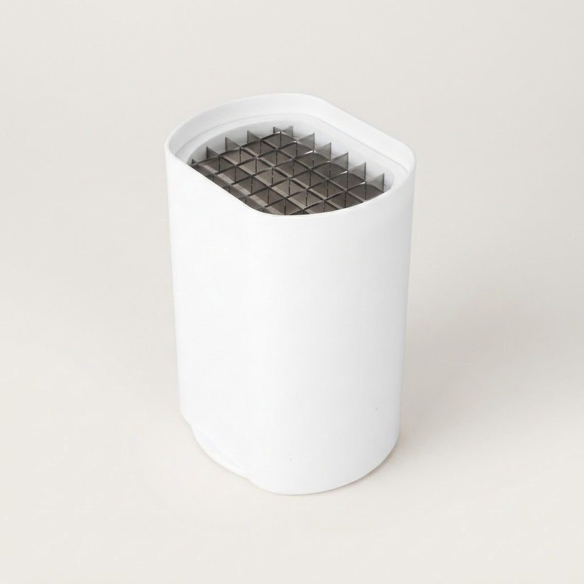A white cylindrical replacement filter or component with a dark gray triangular mesh screen at the top, shown on a clean, light beige background.