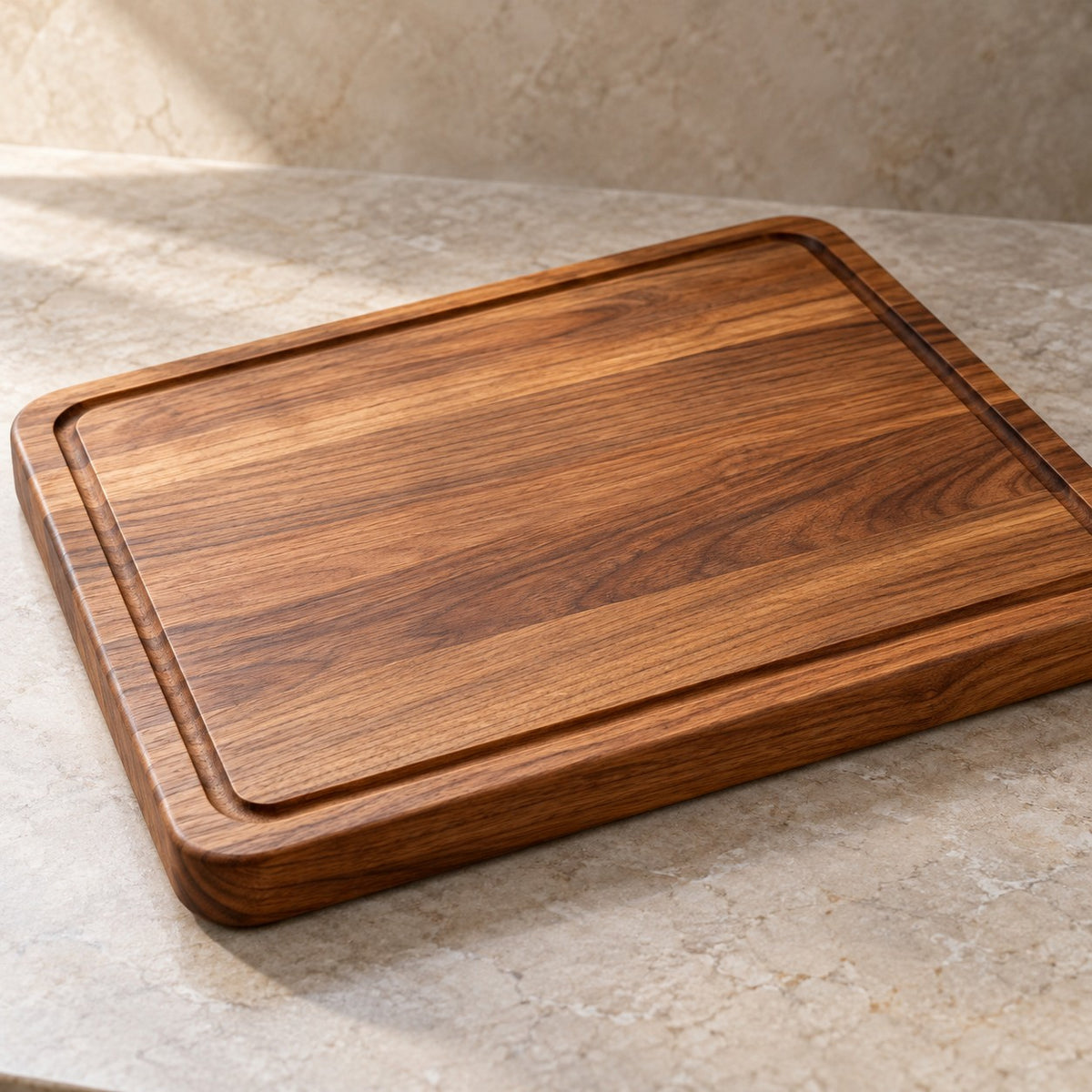 A warm brown wood cutting board shows its recessed perimeter groove and rounded edges in a close hero view.