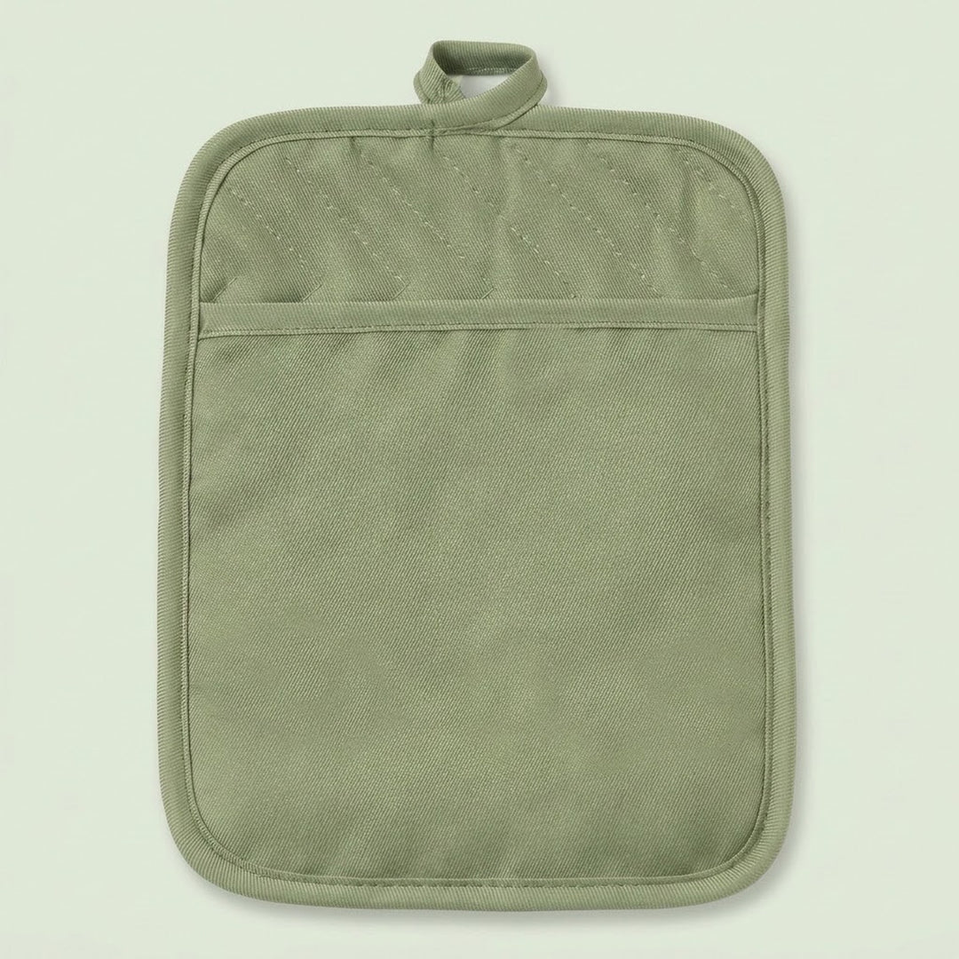An olive green quilted fabric pot holder with a top loop handle and a horizontal seam creating a front pocket, shown against a solid pale green background.