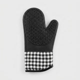 A single oven mitt with a black quilted textured top half and a black and white gingham checkered fabric cuff, shown against a plain light gray background.