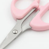 Pink plastic-handled scissors with silver metal blades, shown close up on a white background.