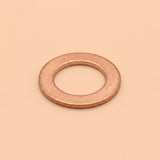 A single flat metal washer with a warm copper or rose-gold metallic finish, centered on a solid peach-beige background.