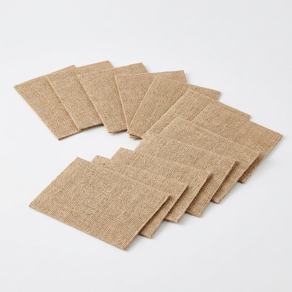 Rectangular natural beige burlap coasters overlap in a curved, staggered arrangement on a white background.