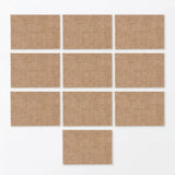 Nine rectangular tan burlap or linen-style cards arranged in a staggered grid on a plain white background.