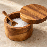 Acacia wood salt cellar with a 360-degree swivel lid turned aside for easy access.