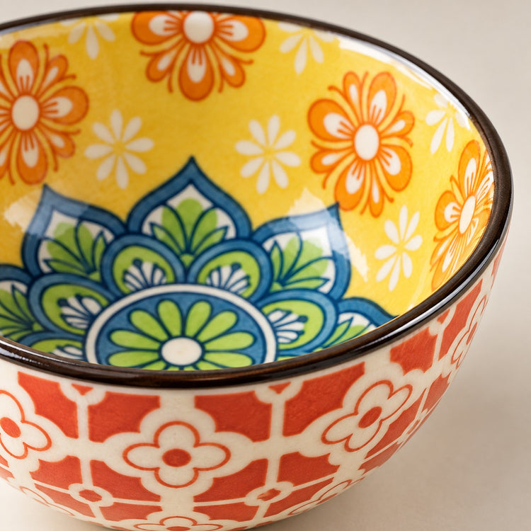 Close-up of the glossy ceramic glaze, dark rim, and painted pattern on a Bohemian Ceramic Sauce Bowl.