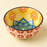 Bohemian Ceramic Sauce Bowl showing its glossy floral exterior and ornate patterned interior.