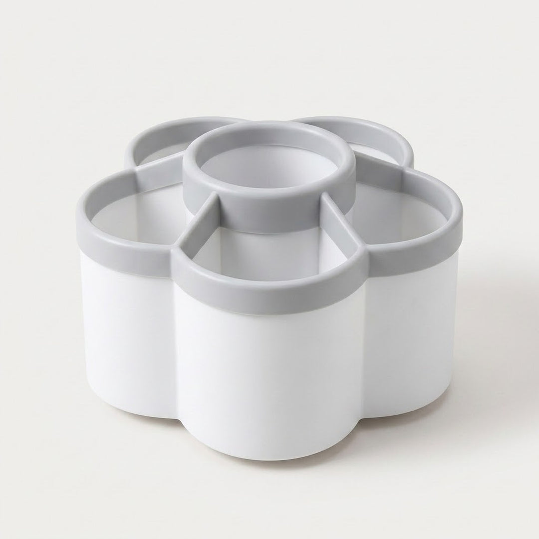 A white and gray multi-compartment organizer tray with a flower-like segmented design, photographed on a clean off-white background.