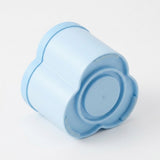 A light blue flower-shaped plastic container or cup with a matching screw-on lid, shown on a clean white background.