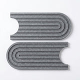 Two gray felt key hooks with a modern wavy, layered design, displayed on a clean white background.