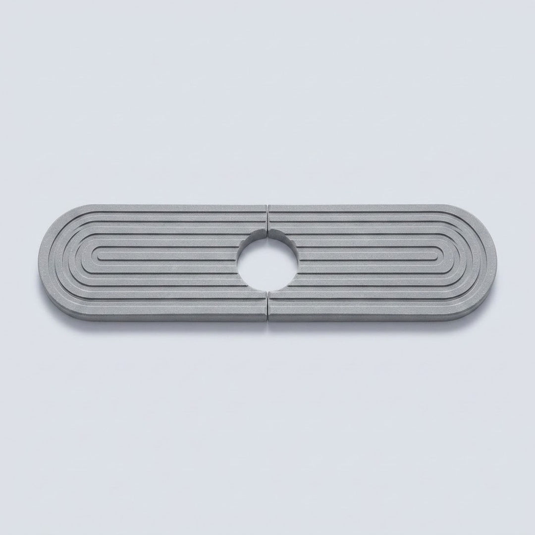 A metallic silver oval-shaped hardware piece with concentric ridges and a circular cutout in the center, shown on a light gray background.