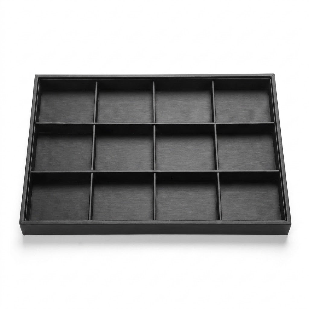 A rectangular black wooden jewelry organizer tray with twelve individual compartments, shown from a top-down perspective on a white background.