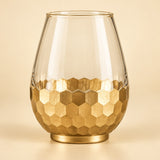 Small Gold Honeycomb Glass Vase shown alone against a soft warm gold studio background.