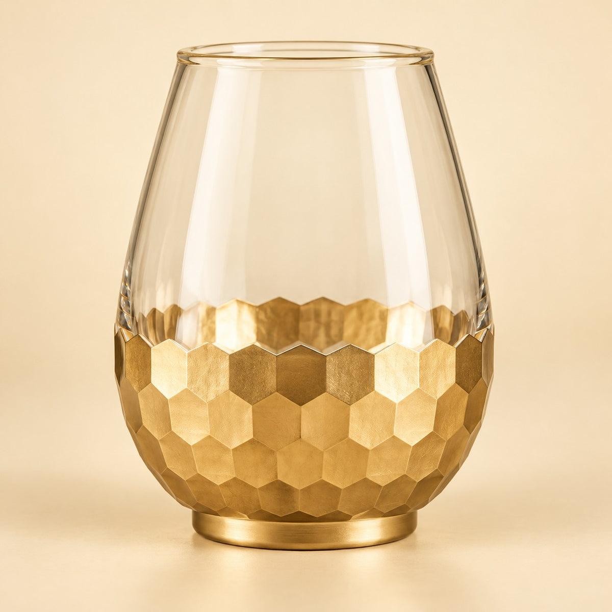 Small Gold Honeycomb Glass Vase shown alone against a soft warm gold studio background.